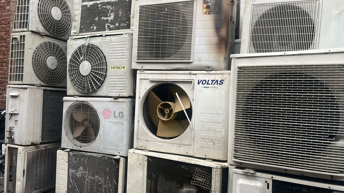 Stacked used AC outdoor units collected in Hyderabad